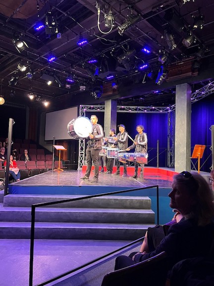 A drumline performs on the mainstage of frank 2023. 